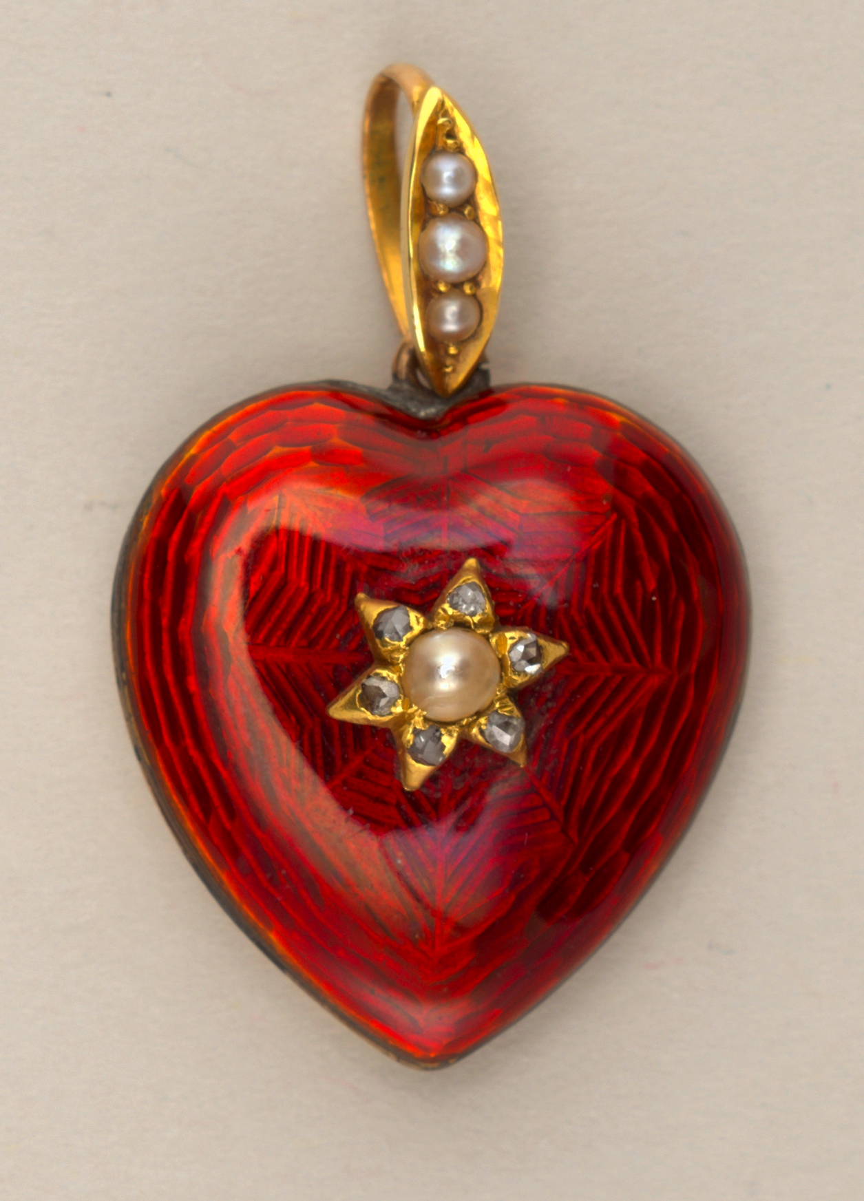 Red enamel and pearl heart shaped locket