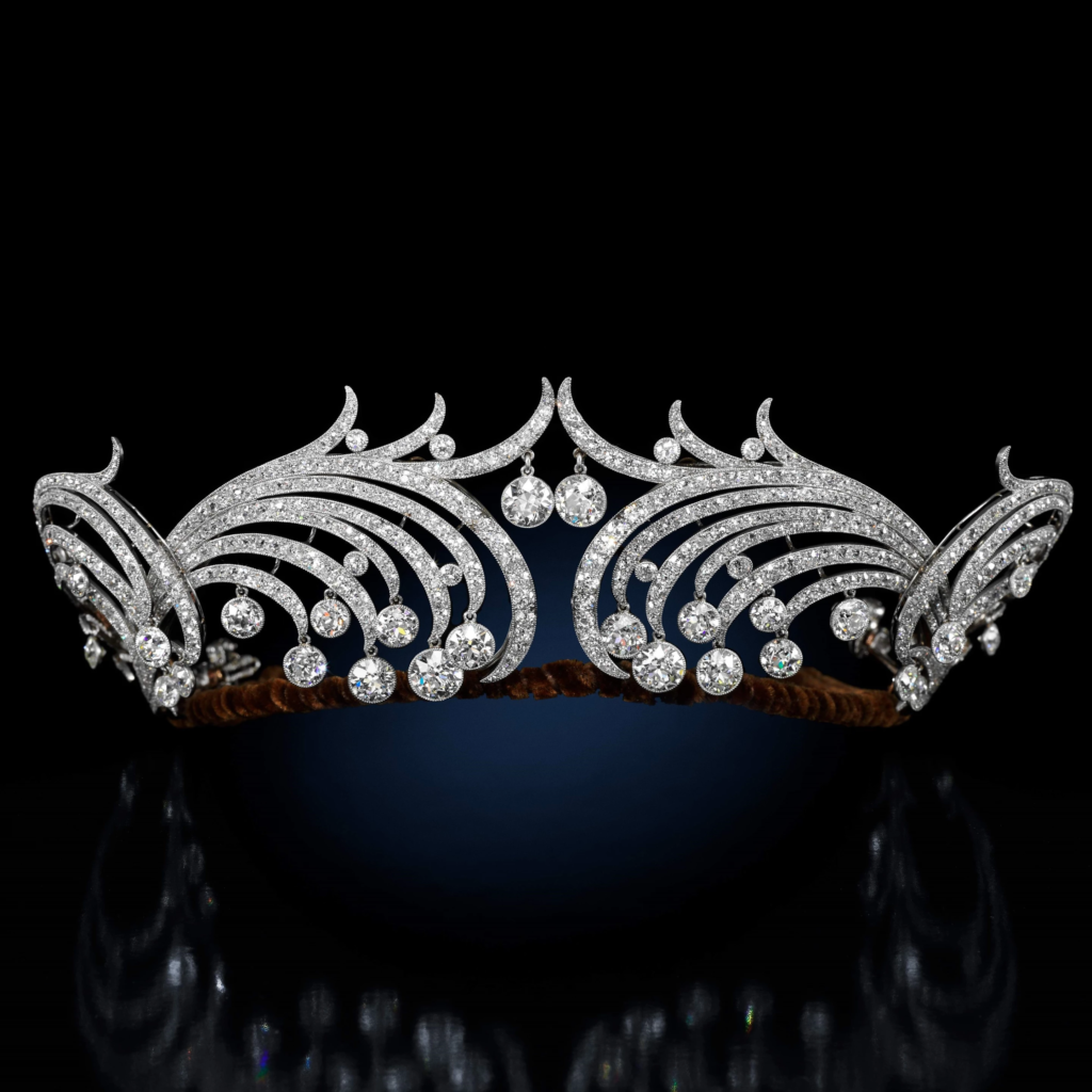 Diamond waveform tiara, by Cartier 1904. The tiara is made up of curved diamond scrolls which end in larger brilliant-cut diamonds. 