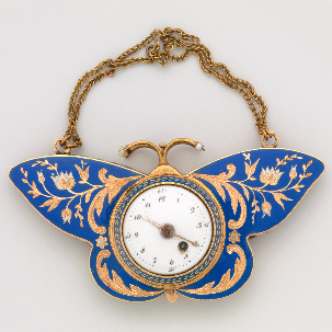 Watch with gold suspension chains. Shaped like a butterfly seen from the front with wings enamelled in royal blue. A floral design in gold reserved against the background decorates the wings. The centre of the jewel is set with a circular watch face with hour and minute markings. 