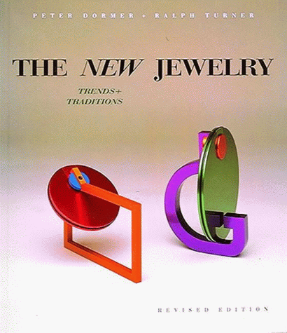 Cover image of 'The new jewelry'. Graduated fawn background on which are placed two geometric rings, one red and one green and purple. 