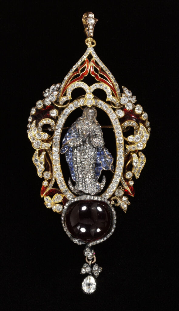 Moon symbolism: Enamelled gold pendant-brooch, set with diamonds and sapphires, in the form of the Virgin on a sickle moon above the carbuncle/ garnet symbolising the world. The Virgin is set in an oval frame of diamonds, surrounded by diamond and enamel leafy decorations. 