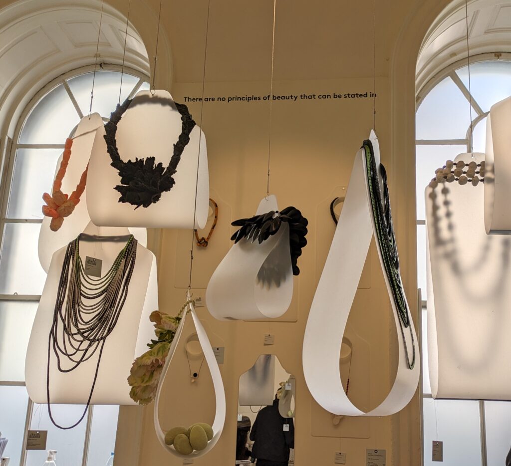 Hanging selection of necklaces from the Object Beautiful gallery at Somerset House, Collect 2024.