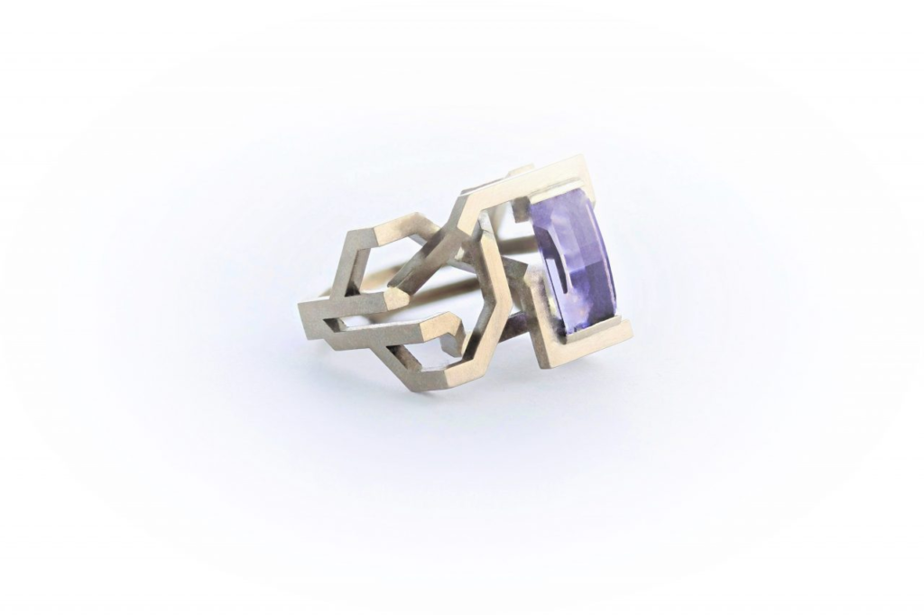 Gold and gemset ring by Mark Newman, Collect 2024.