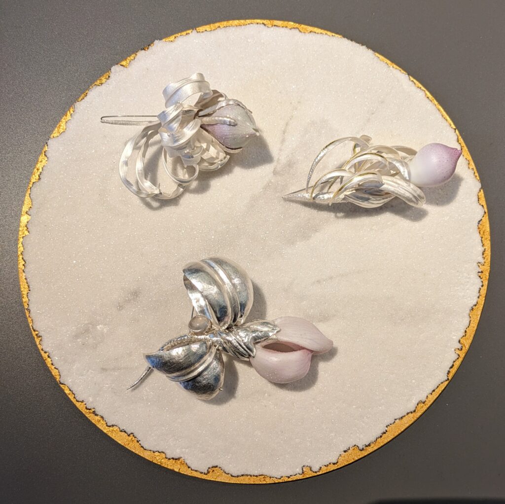 Group of three silver and ceramic brooches by Xiaoli Ning, Collect 2024.