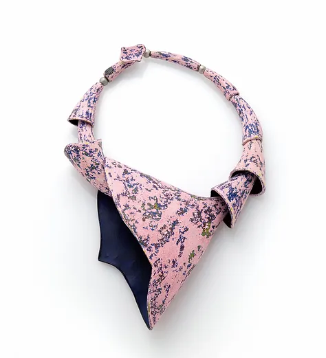 Pink and black copper enamelled neckpiece by Hee Joo Kim, Collect 2024. 