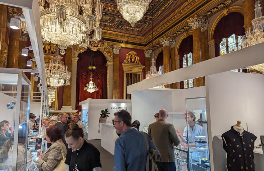 View of jewellery stands and visitors at Londons' Goldsmiths Fair