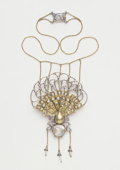 Silver and gold necklace with a peacock pendant. Set with pearls and diamond sparks. Designed by C. R. Ashbee. English; London, 1901.