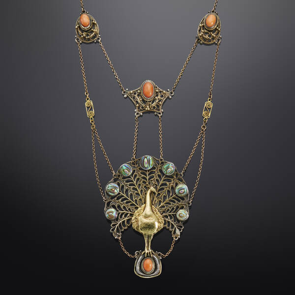 Peacock pendant with abalone shell and cabochon coral likely made by the Guild of Handicraft with contemporary chain by another Arts & Crafts guild workshop; c. 1900.